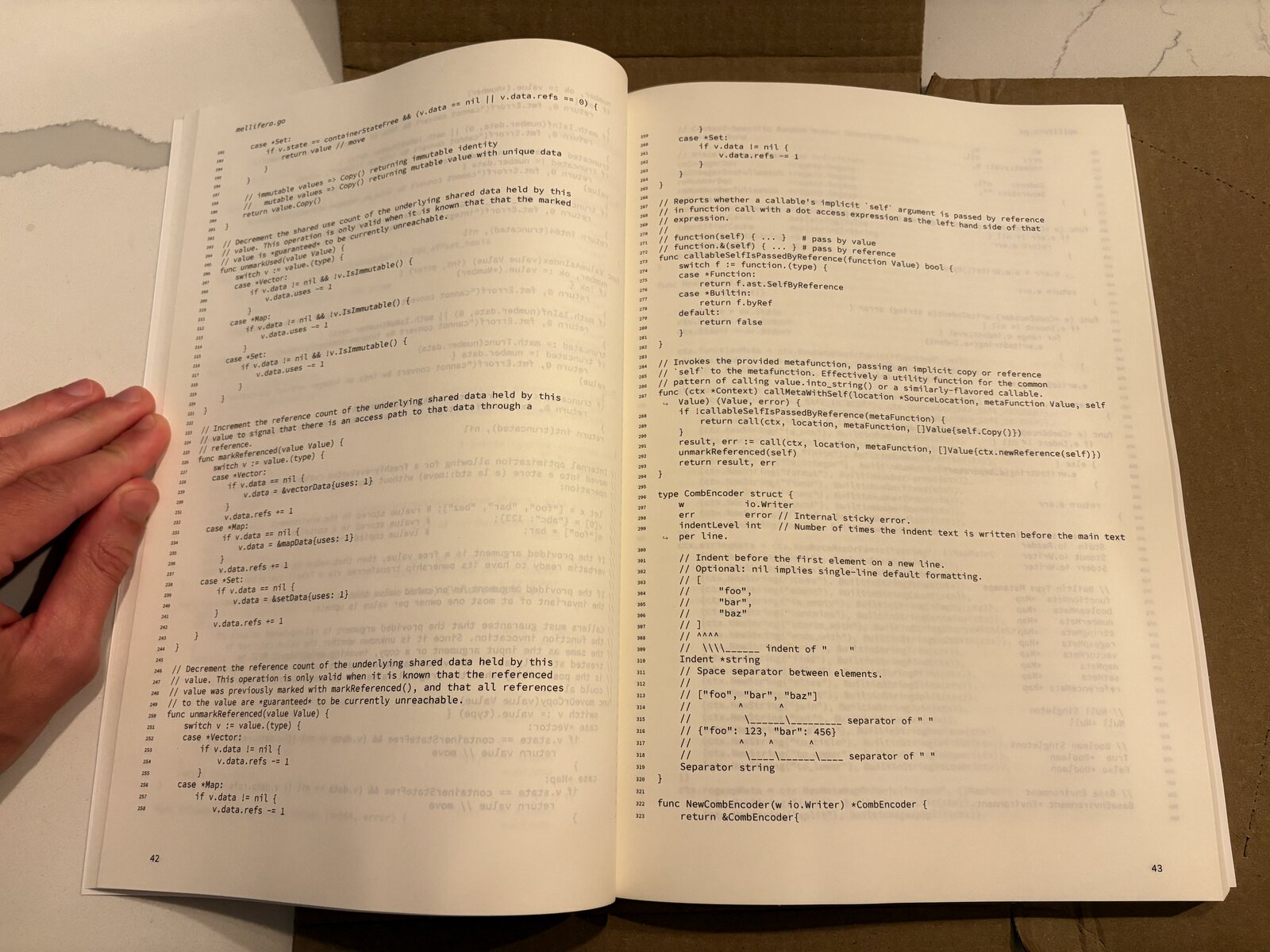 A look inside "The Mellifera Programming Language" book showing a section of the primary Mellifera interpreter, written in Go. These particular pages show some utility functions, as well as the CombEncoder data structure used to serialize Mellifera values.